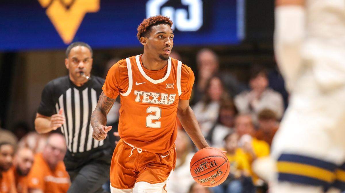 Texas Longhorns guard Arterio Morris (2) dribbles the ball during the first half against the West Virginia Mountaineers at WVU Coliseum on January 21, 2023.