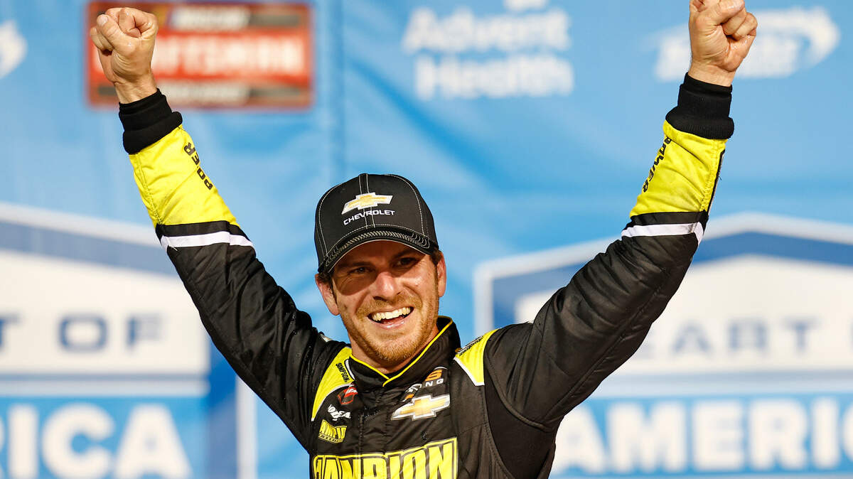 NASCAR Truck Series driver Grant Enfinger (23) reacts after winning the Heart of America 200 at Kansas Speedway on May 6, 2023.