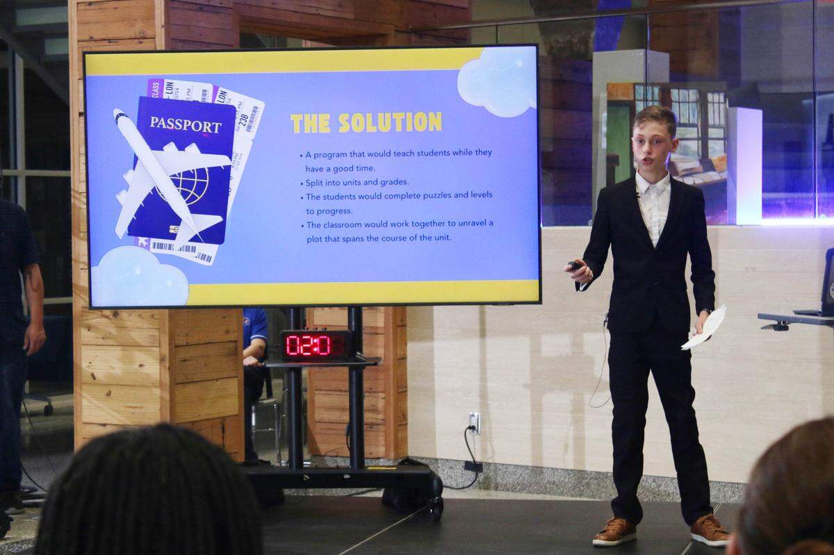 Miles Muehlbach, a seventh-grader at Indian Hills, presents his idea for a game that he thinks will help kids with math lessons. He won one of three main awards to fund it at The Next Great Idea Pitch Competition Saturday.