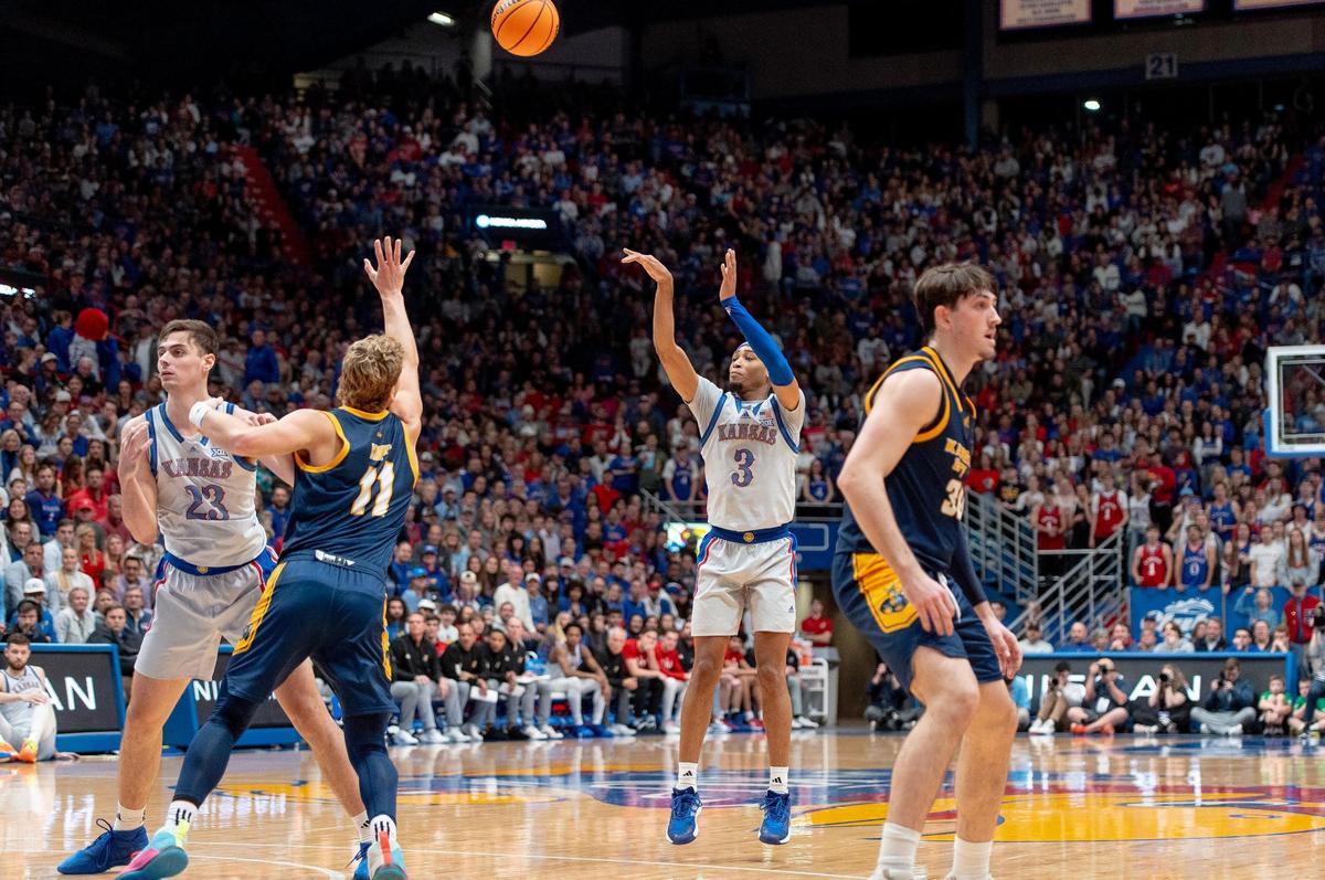 Kansas Jayhawks guard Dajuan Harris Jr. (3) shoots a 3-pointer against the KC Roos during a game on Tuesday, Dec. 5, 2023, in Lawrence, Kan.