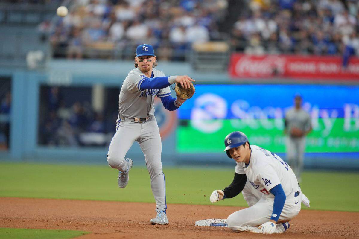 Kansas City Royals shortstop Bobby Witt Jr. (7) forces out Los Angeles Dodgers designated hitter Shohei Ohtani (17) at second base in the third inning at Dodger Stadium on June 14, 2024.