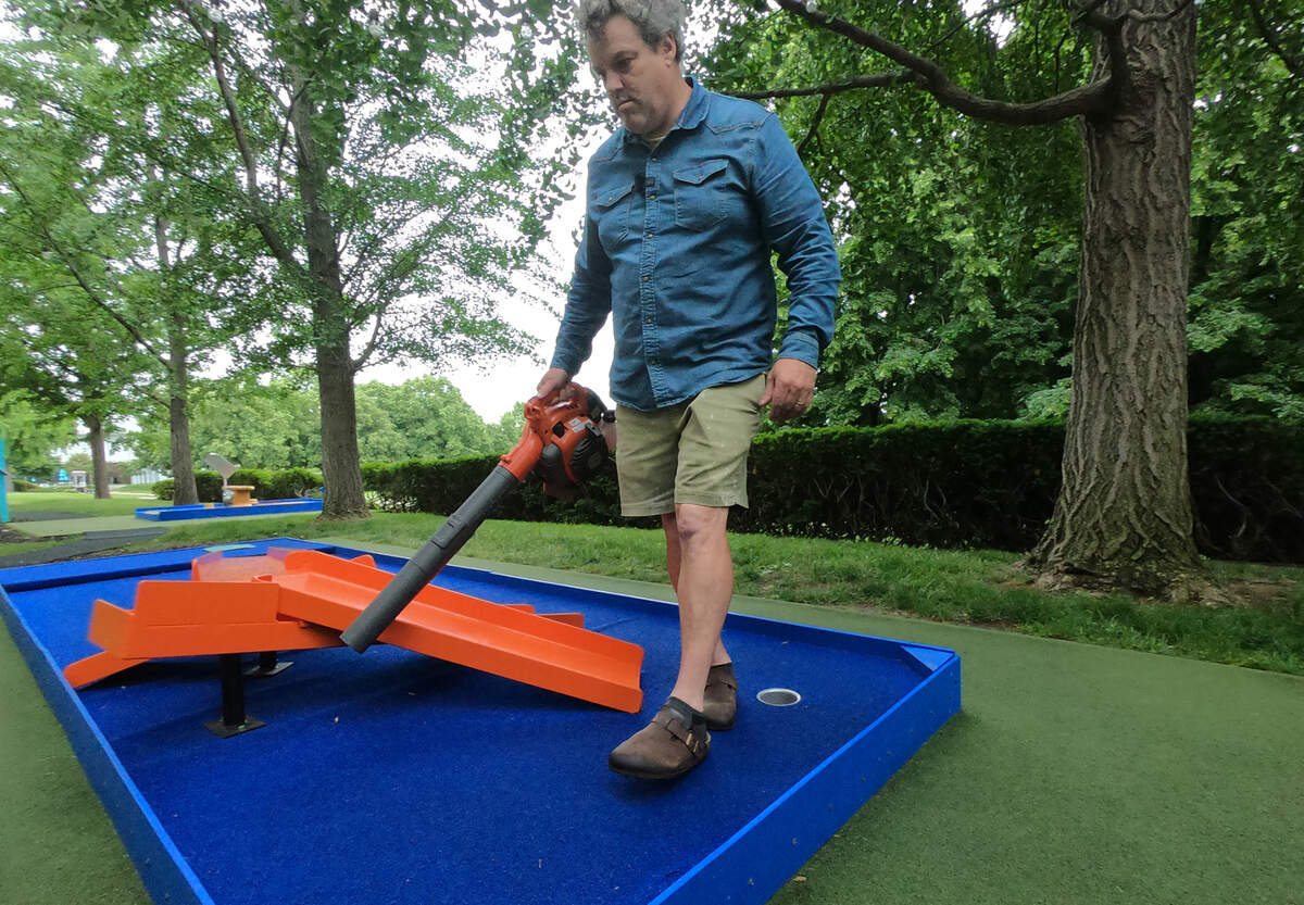 James Throckmorton blows leaves and does some general upkeep on hole 5 “Zoomy” at the Art Course.