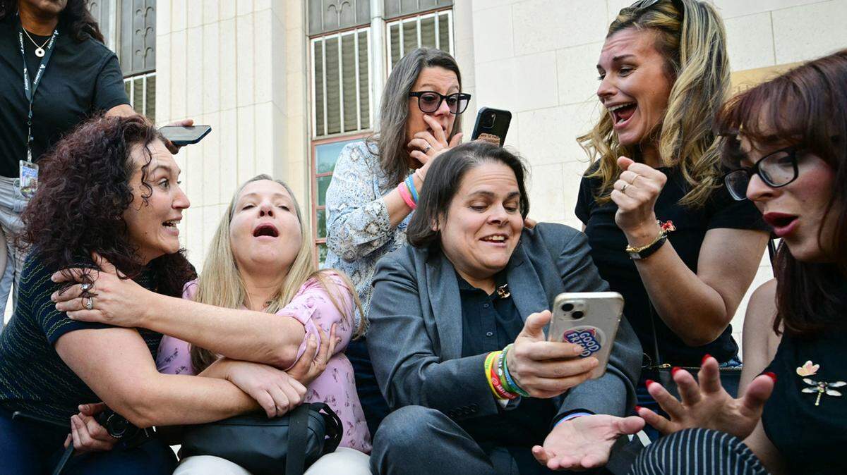 Family members and their lawyer react to news that a jury found Meta and YouTube liable in a social media addiction trial in Los Angeles on March 25.