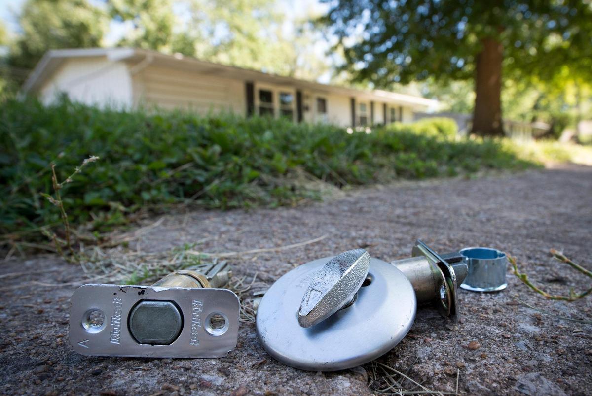 A deadbolt lock lays outside the Kansas City home where Krisi Eiland, 35, a single mother of three, was evicted from last week. Eiland fell behind on her rent after being laid off in March. Despite working a new job at a Family Dollar store, Eiland was earning $4 less an hour and was unable to pay the rent.