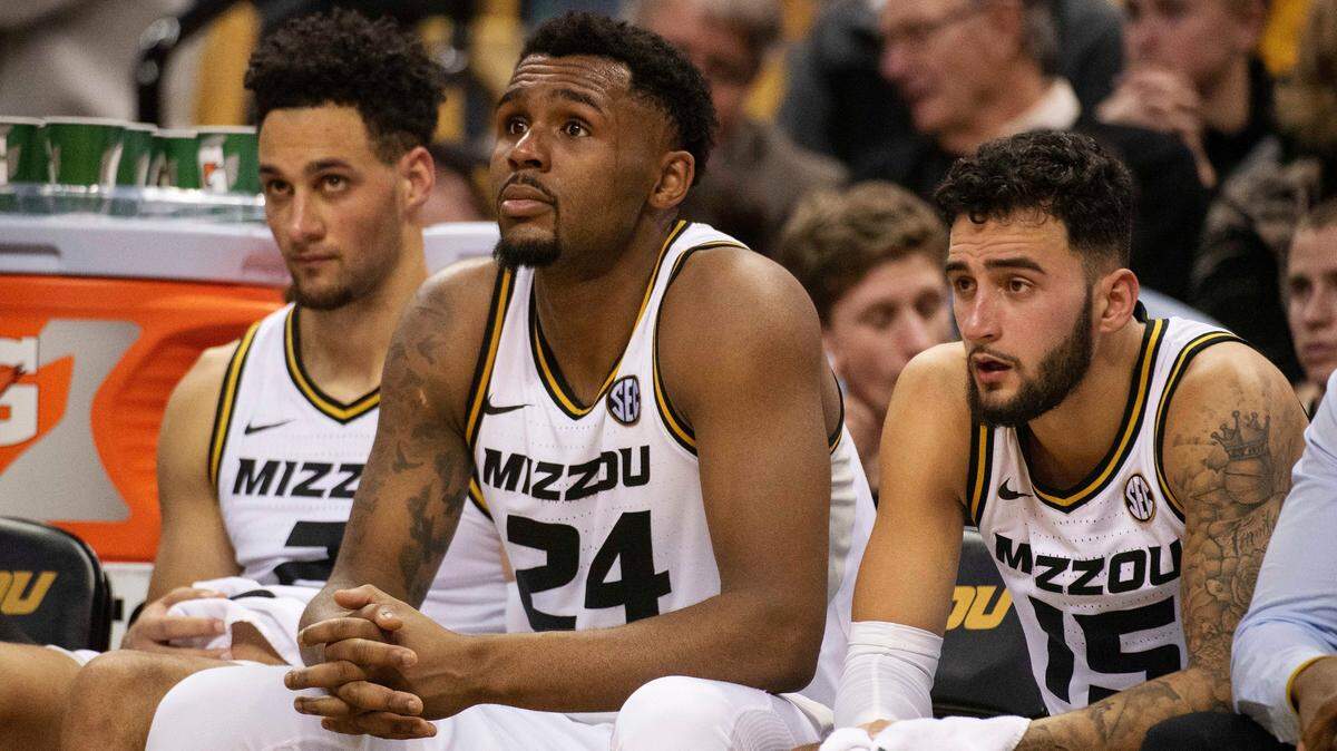 Missouri’s K.J. Santos, left, Kevin Puryear, center, and Jordan Geist, right, watch the final minutes of their 87-63 loss to Tennessee from the bench during an NCAA college basketball game Tuesday, Jan. 8, 2019, in Columbia, Mo. (AP Photo/L.G. Patterson)