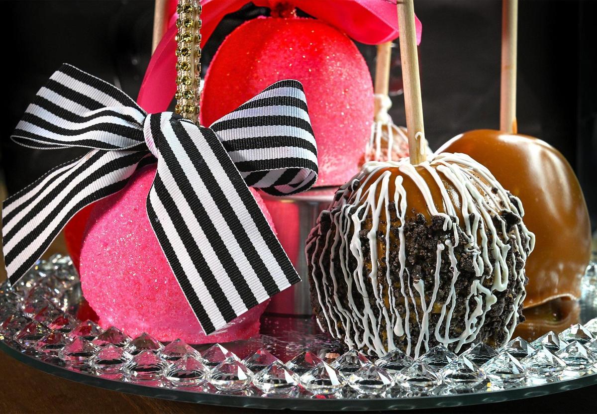 Among the specialty candy apples at Keisha Kandi Apples, from left: piña colada, Oreo caramel apple, and caramel apple.