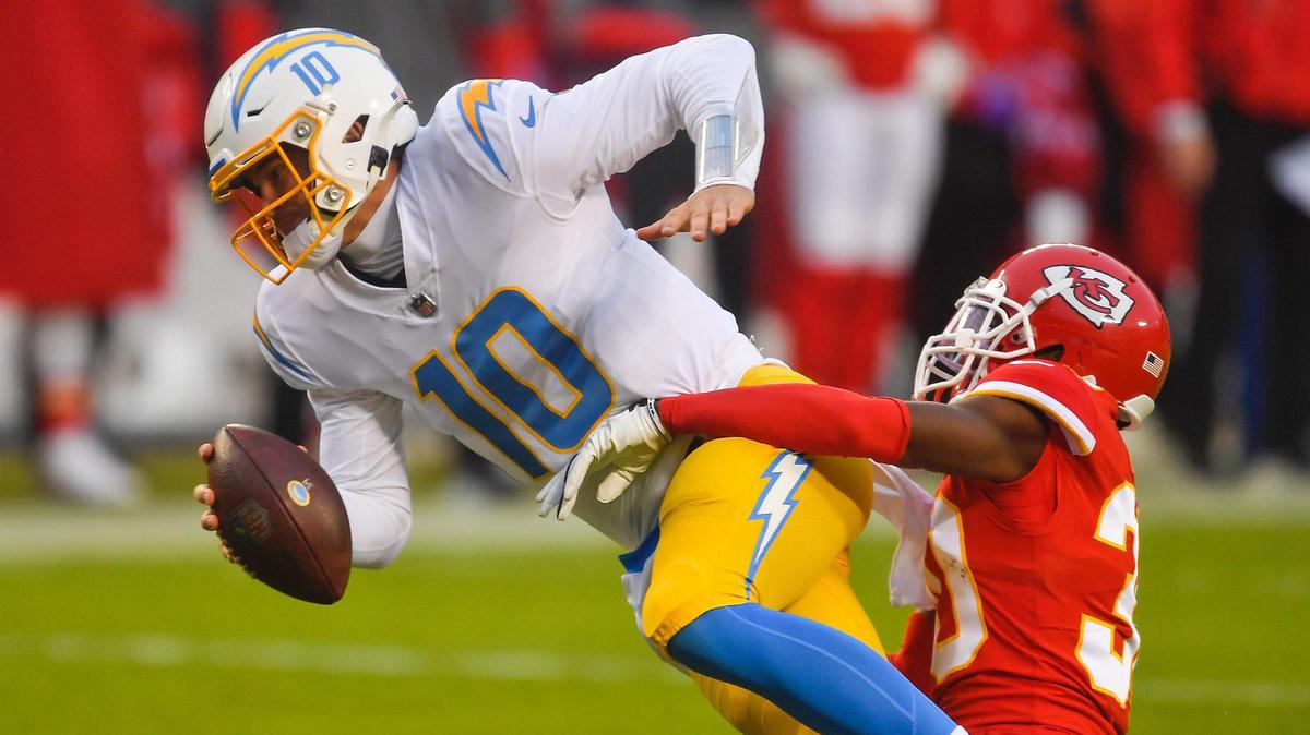 Kansas City Chiefs cornerback Deandre Baker sacks Los Angeles Chargers quarterback Justin Herbert in the second quarter Sunday, January 3, 2021, at Arrowhead Stadium in Kansas City, Missouri.