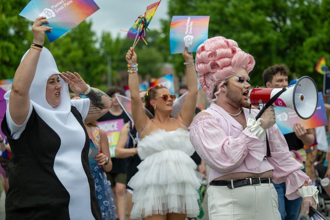 Vantas, right, a performer in drag, gets the parade crowd fired up while marching with Planned Parenthood Great Plains in the KC Pride Parade on Saturday in Kansas City. Vantas is from Lawrence.
