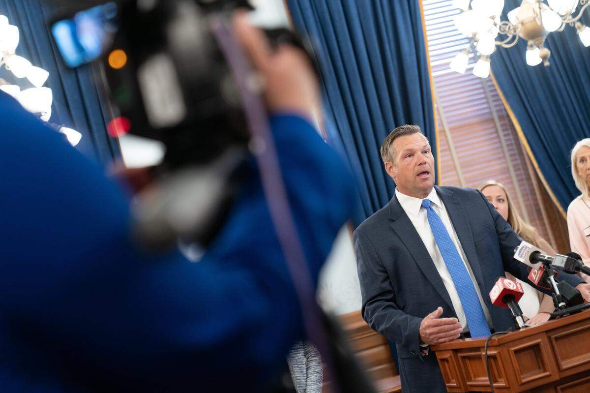 Kansas Attorney General Kris Kobach briefs the media. Kobach as secretary of state championed a proof of citizenship voter registration law later found to be unconstitutional.