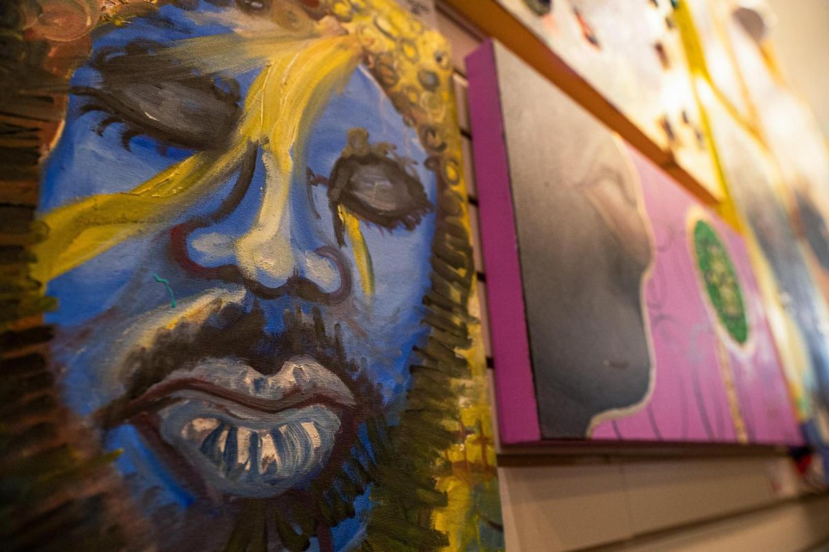 Paintings by artist Adrianne D. Clayton are on exhibit at the Natasha Ria Art Gallery.