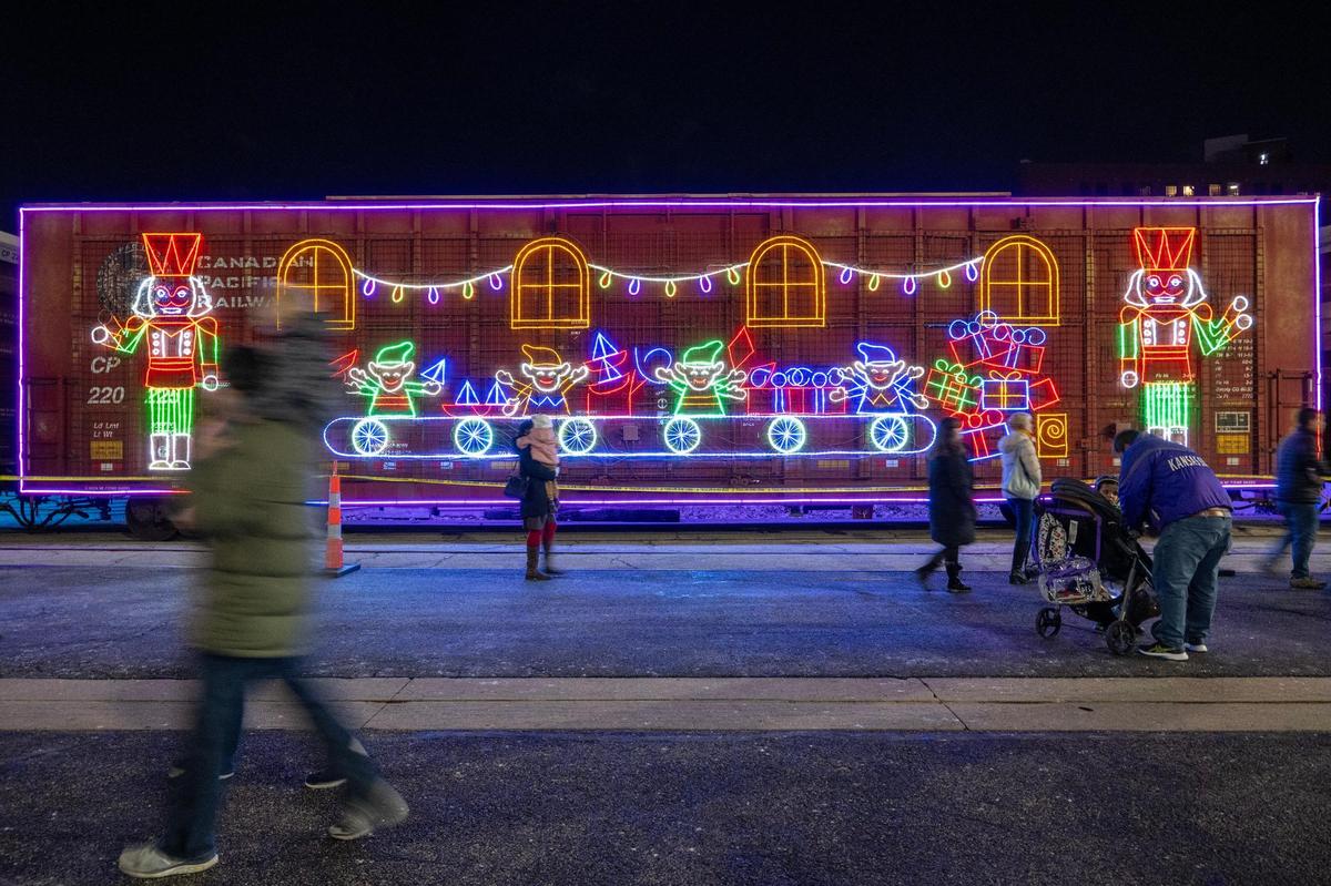 Bright LED lights illuminate a train car of the Canadian Pacific Kansas City Holiday Train at Union Station on Monday, Nov. 27, 2023, in Kansas City. In its 25th annual journey, the CPKC Holiday Train arrived with fourteen festively decorated rail cars, serving a charitable purpose by supporting food banks, obtaining contributions and raising awareness about food insecurity issues