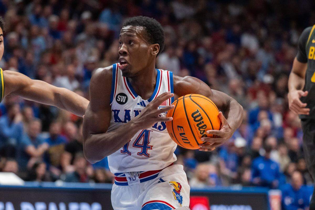 Kansas Jayhawks guard Melvin Council Jr. (14) drives the ball into the lane in the first half of the Jayhawks game vs. the Baylor Bears on Friday, January 16, 2026, at Allen Fieldhouse.