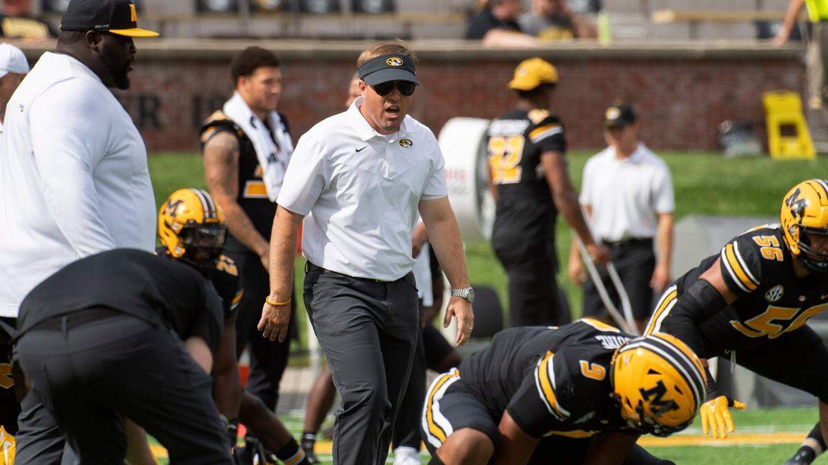 Missouri head coach Eliah Drinkwitz watches his players warm up before the start of an NCAA college football game against North Texas Saturday, Oct. 9, 2021, in Columbia, Mo. (AP Photo/L.G. Patterson)