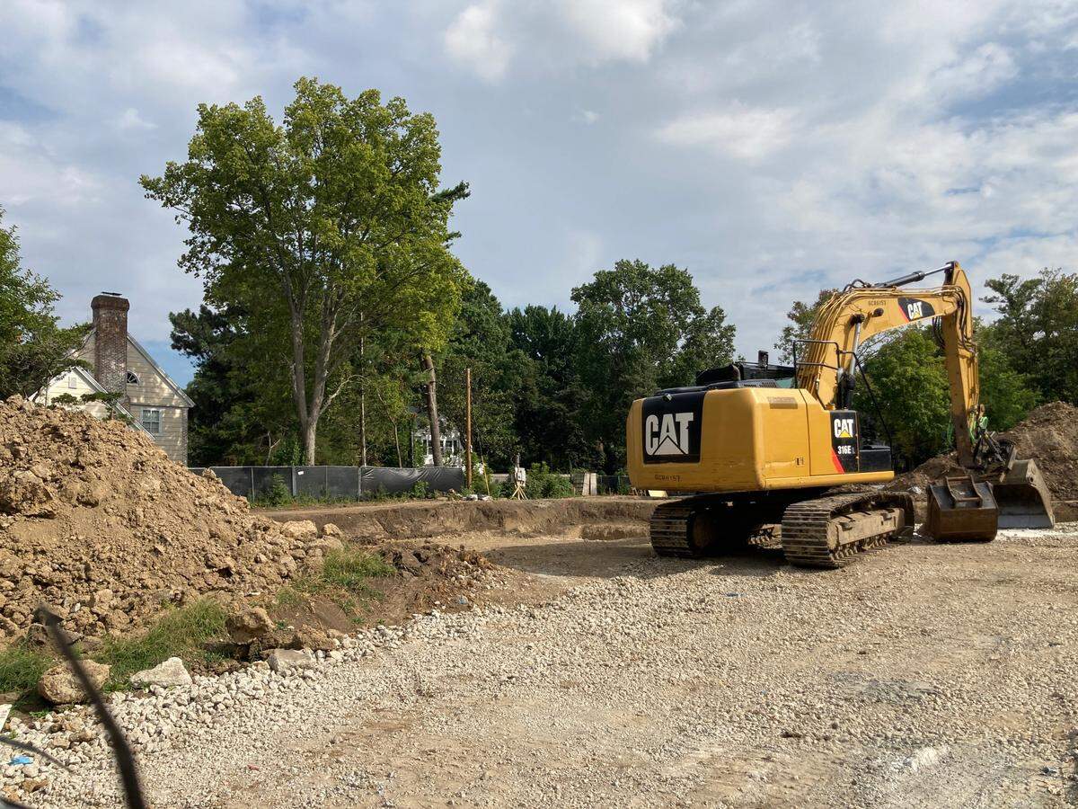 An excavator where earth is now being moved to dig the foundation for the new, $7.1 million modern home under construction at 6315 Ward Parkway.