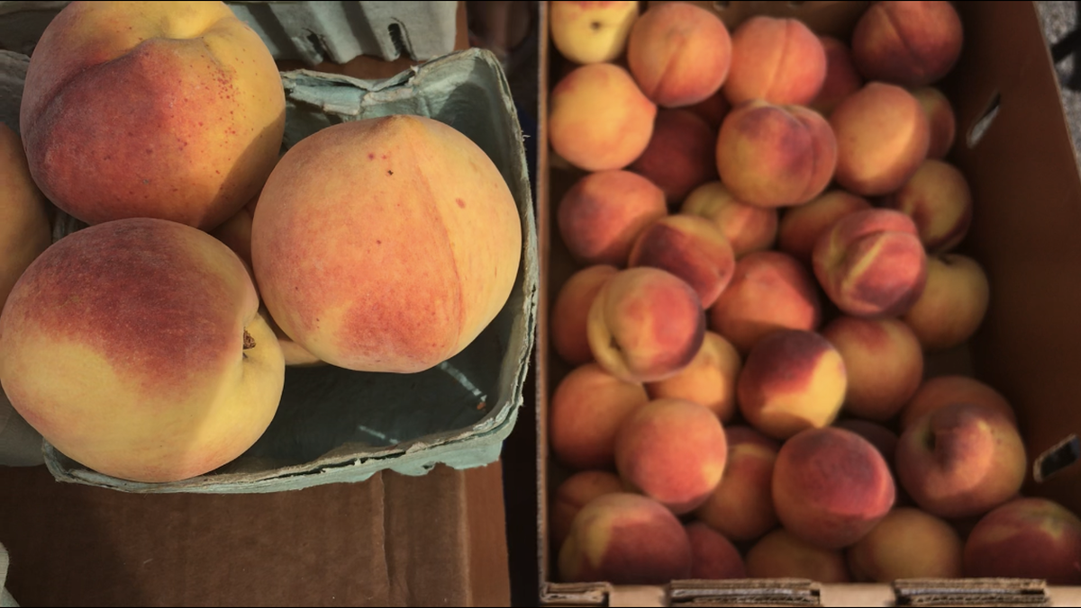 A few booths had peaches at the Overland Park Farmers’ Market on Saturday. A spring freeze decimated some local crops.