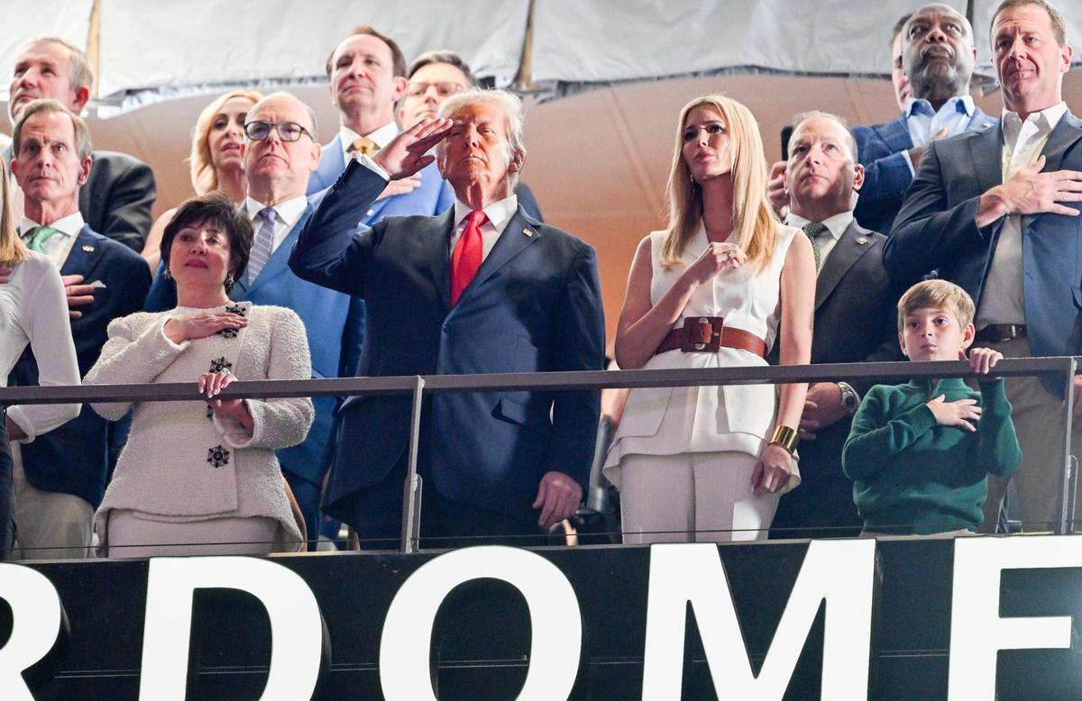President Donald Trump, center, New Orleans Saints owner Gayle Benson, left, and Ivanka Trump, right, stand for the national anthem during Super Bowl LIX on Sunday, Feb. 9, 2025, in New Orleans.