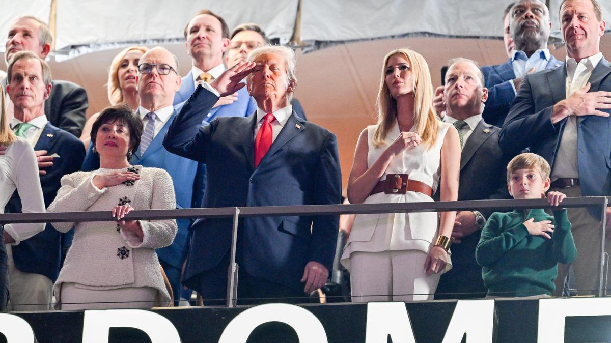 President Donald Trump, center, New Orleans Saints owner Gayle Benson, left, and Ivanka Trump, right, stand for the national anthem during Super Bowl LIX on Sunday, Feb. 9, 2025, in New Orleans.