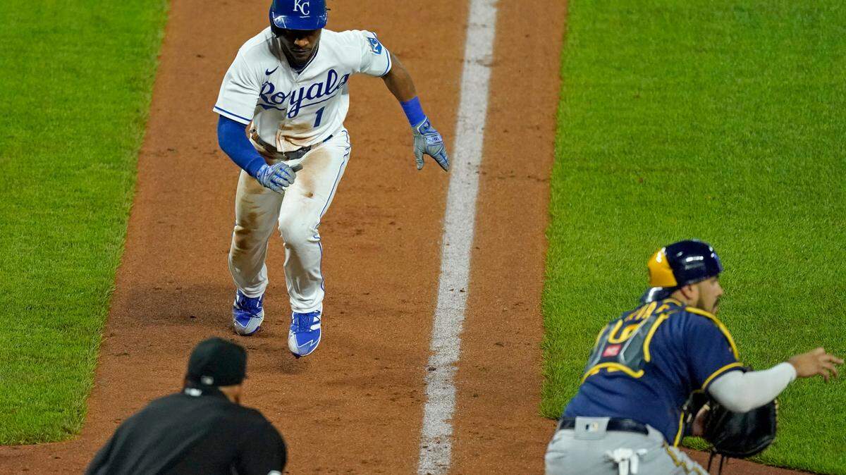 Kansas City Royals’ Jarrod Dyson (1) runs home to score on a bunt single by Nicky Lopez during the seventh inning of a baseball game against the Milwaukee Brewers Wednesday, May 19, 2021, in Kansas City, Mo. (AP Photo/Charlie Riedel)