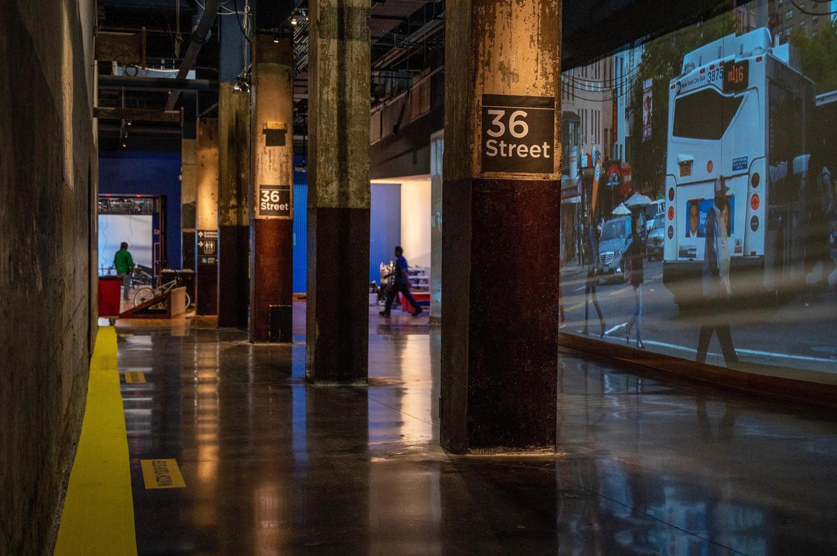 Pillars and video screens resembling a New York subway train stop are seen on display during the “Spider-Man: Beyond Amazing” exhibit set up Monday at Union Station.
