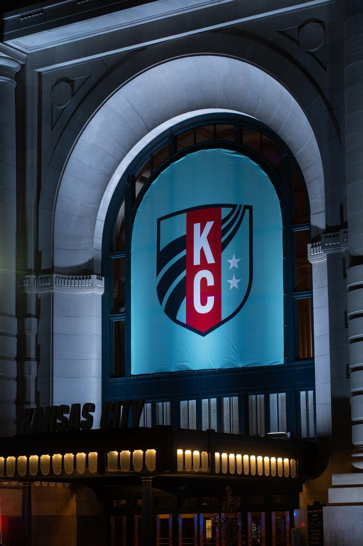 KC Current banners hang on the outside of Union Station in preparation for the opening of the team’s history-making stadium on March 16.
