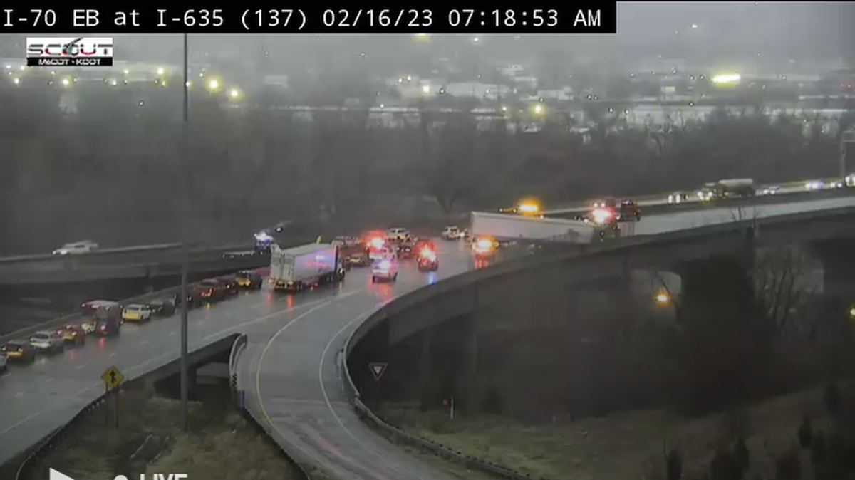 Part of Interstate 635 was shut down Thursday morning as a semi truck hang off the overpass.
