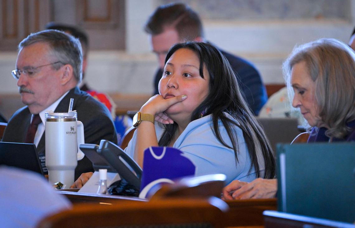 Rep. Christina Haswood, a Democrat from Lawrence, center, listened to a debate in the Kansas House of Representatives in Topeka.