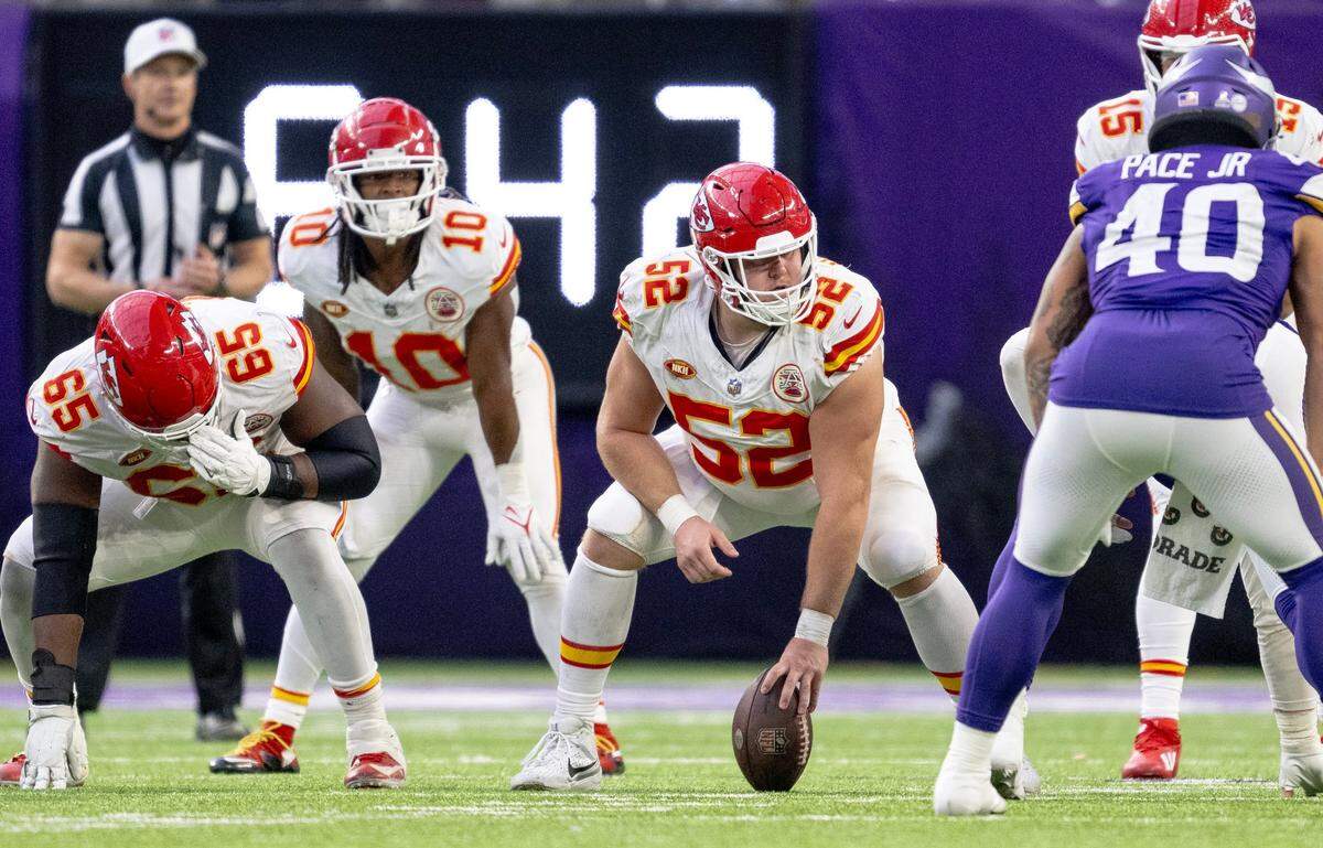 Kansas City Chiefs center Creed Humphrey (52) readies to snap the ball against the Minnesota Vikings during an NFL football game on Sunday, Oct. 8, 2023, at U.S. Bank Stadium in Minneapolis, Minn.
