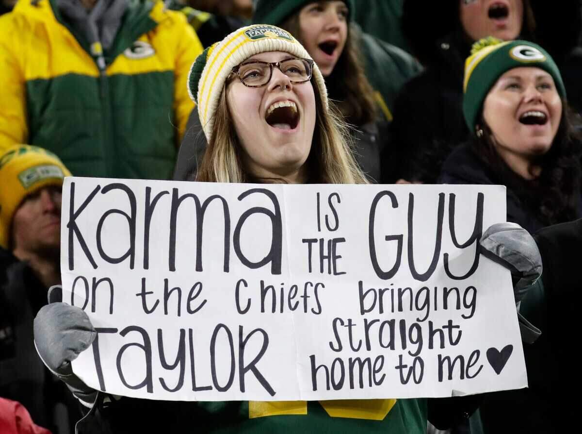 A Taylor Swift fan shows off her sign during their football game Sunday, December 3, 2023, at Lambeau Field in Green Bay, Wisconsin.