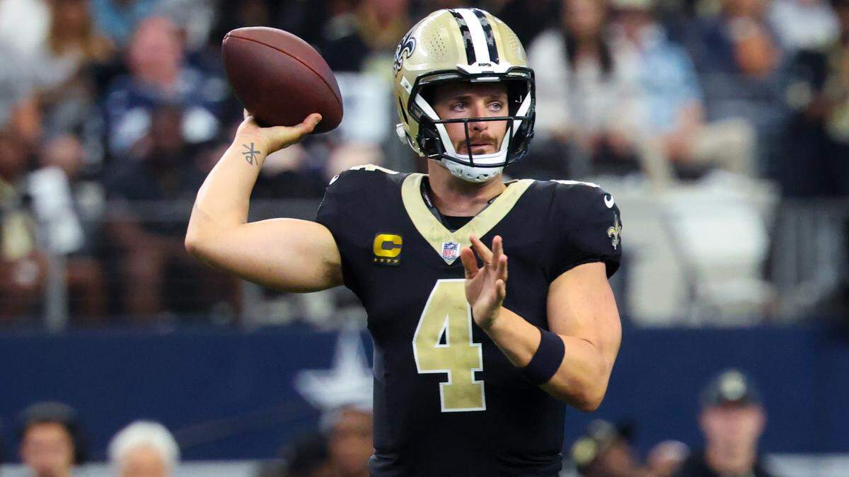 New Orleans Saints quarterback Derek Carr (4) throws during the first half against the Dallas Cowboys at AT&T Stadium.