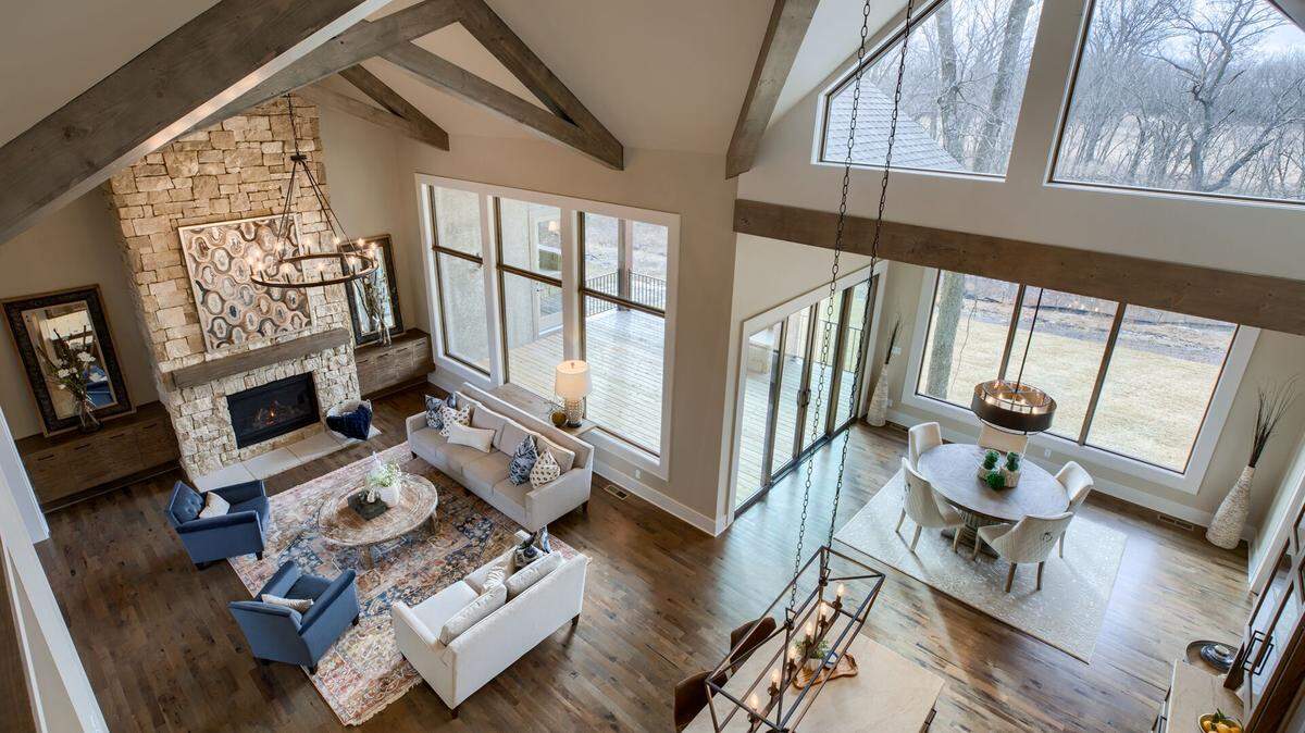 Light floods the great room and dining room in this stunning home by Ashner Construction Company. The home is one of more than 400 in the 2019 Spring Parade of Homes.