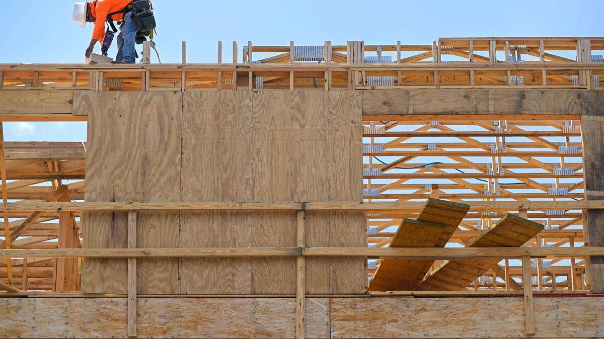 A construction worker works on the Residence on Rock Creek apartment complex at 5399 Martway St., on the site of the old Mission Bowl, in July 2023. Construction projects often require city permits, which have been available since May 4.