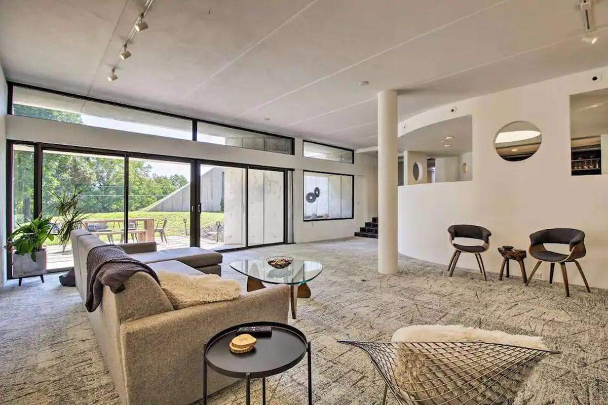 The light-filled living room of a mostly underground Airbnb in Springfield, Missouri.
