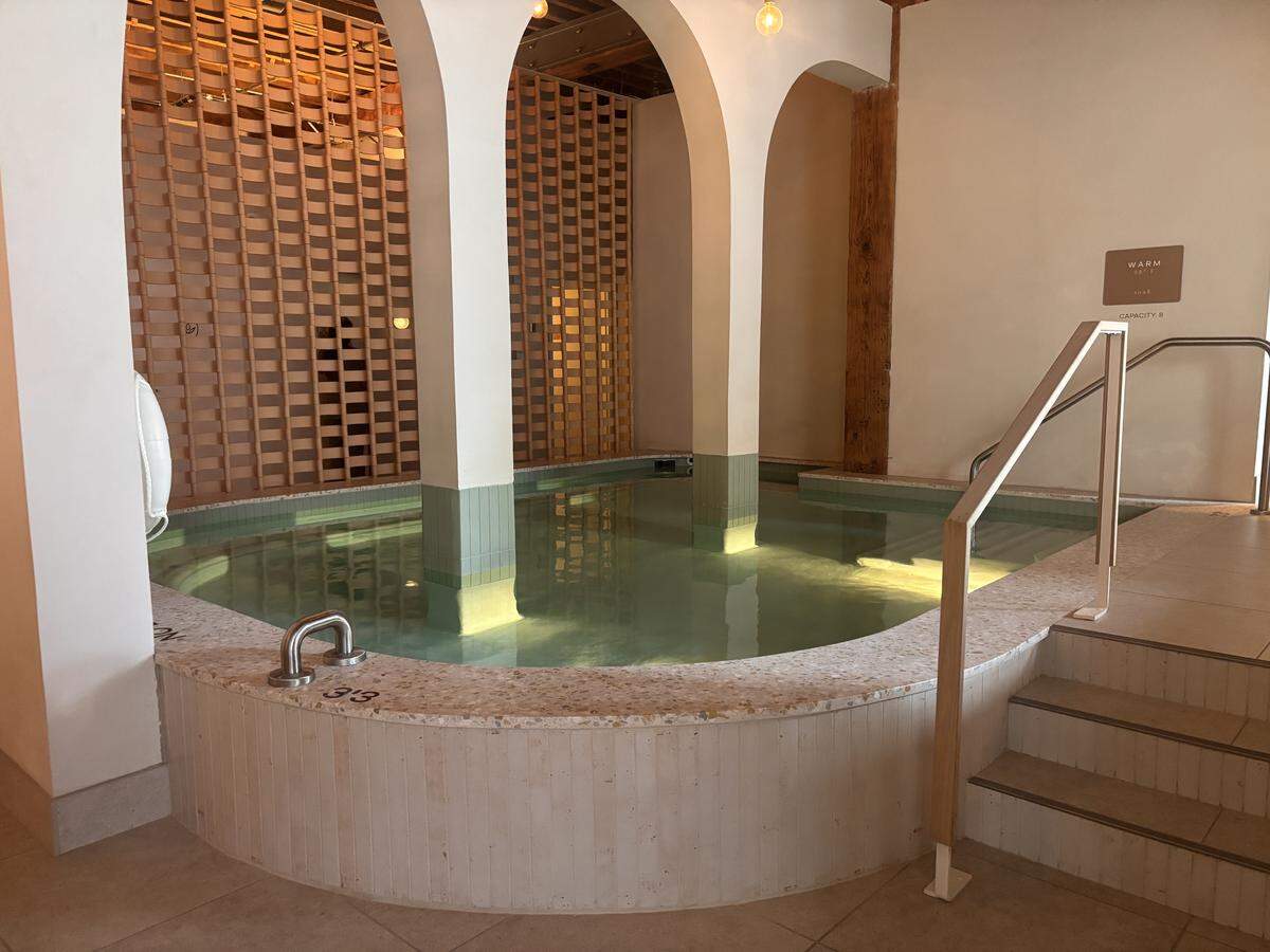 A photo of the warm bath inside of Kla’s bathhouse, heated to 98 degrees.