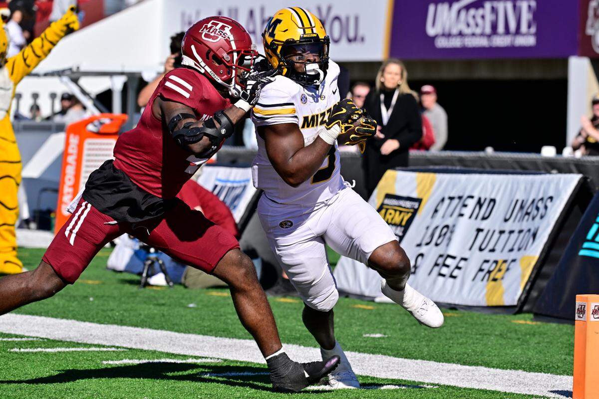 Missouri Tigers running back Marcus Carroll scores one of his three Saturday touchdowns against the Massachusetts Minutemen at Warren McGuirk Alumni Stadium in Amherst, Mass.