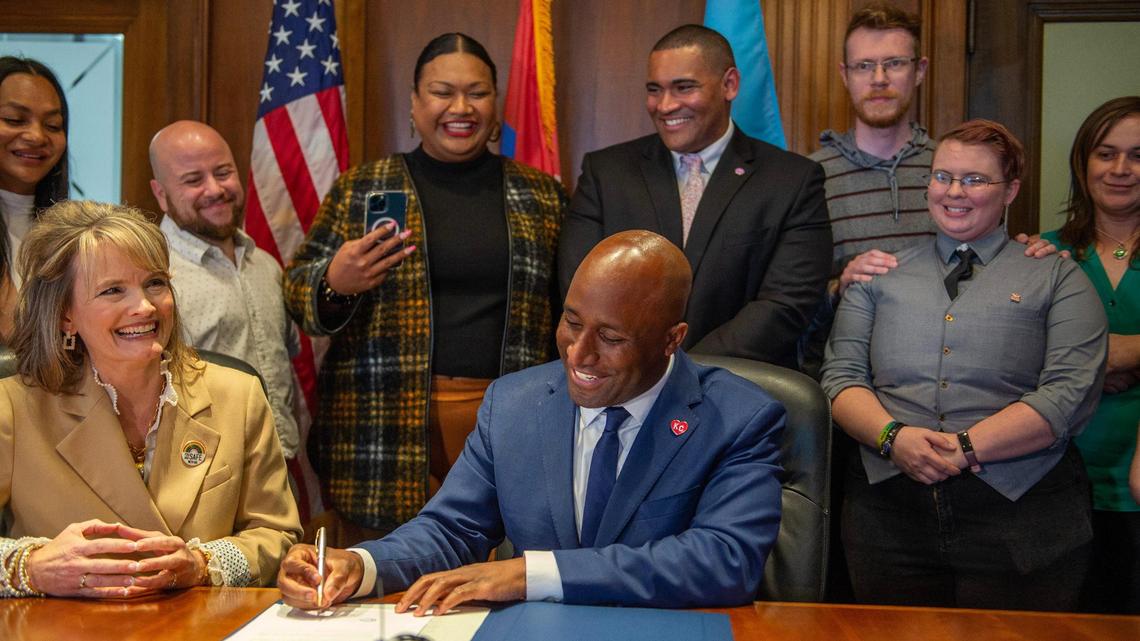 Kansas City Mayor Quinton Lucas signs the Safe Haven resolution bill at Kansas City’s City Hall on Thursday, May 11, 2023. Kansas City Council approved a resolution designating Kansas City a safe haven for gender-affirming healthcare, a 11-1 vote, with Heather Hall voting no.