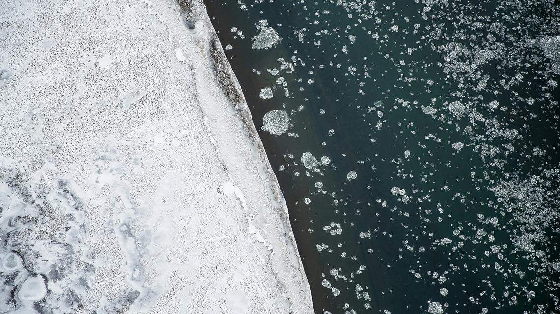 A man who fell through ice covering a lake while driving a UTV was arrested for driving intoxicated, Wisconsin police said.