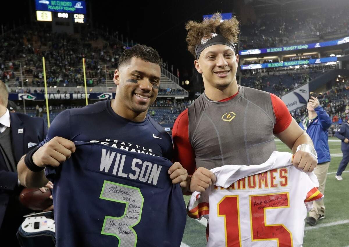 Then with the Seahawks, quarterback Russell Wilson, left, and Kansas City Chiefs quarterback Patrick Mahomes posed for a photo after a game in Seattle in 2018.