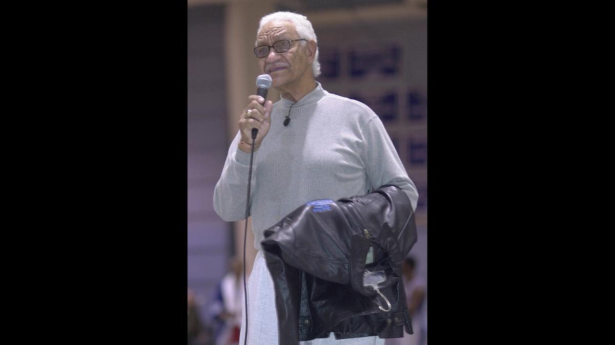 Former Central High School boys basketball coach Jack Bush spoke to a crowd at the school in 2002, when he was honored at halftime of a game with a jacket and kind words by former players.