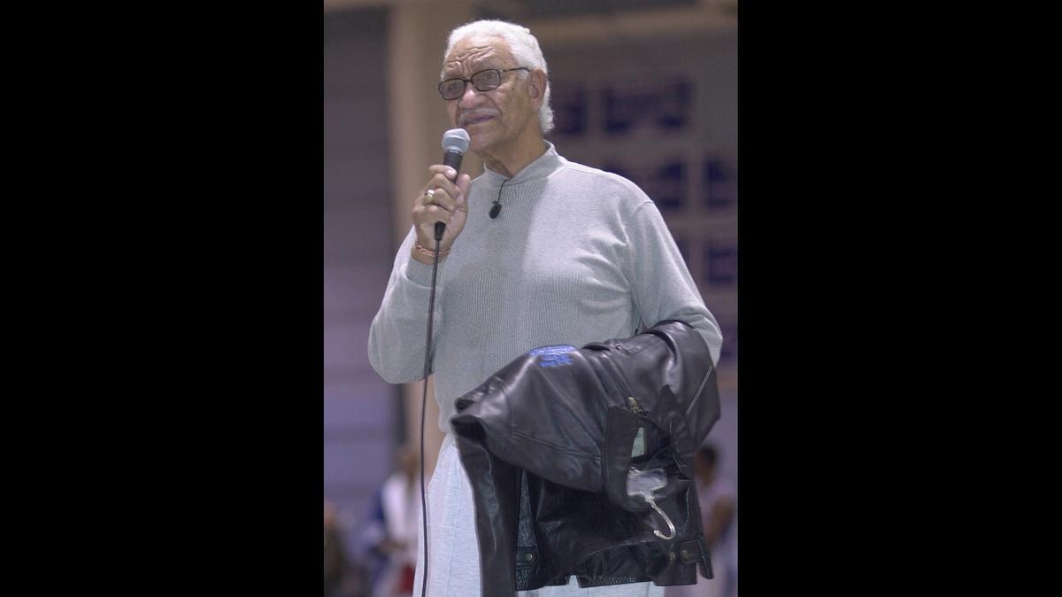 Former Central High School boys basketball coach Jack Bush spoke to a crowd at the school in 2002, when he was honored at halftime of a game with a jacket and kind words by former players.