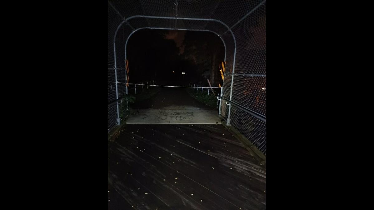 A cyclist crashed after running into a cord that someone apparently tied across a commuter bridge near Madison, Wisconsin. Returning several days later, he found another cord (pictured) tied at the bridge.