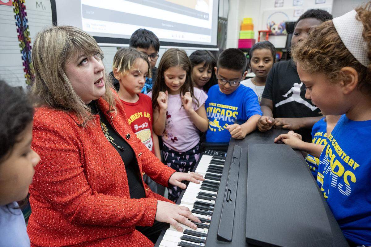 Music and special education teacher Rachel Marlow, named the 2026 Kansas Teacher of the Year, leads her third-graders in a lively rendition of ‘Autumn is Here,’ playing the piano at Central Elementary in Olathe on Wednesday, Sept. 24, 2025.