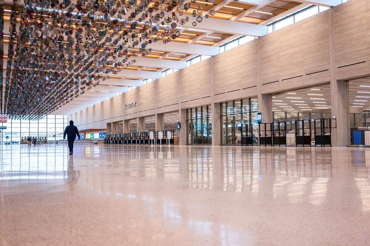 The entry to the new terminal at Kansas City International Airport includes this wall, 732 feet long, 30 feet tall, made of Phenix Napoleon gray marble from a Missouri limestone quarry with a storied history.