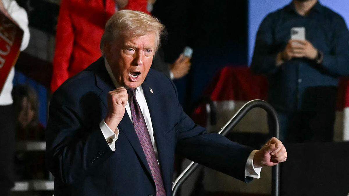 US President Donald Trump dances after speaking at a political rally in Rocky Mount, North Carolina on December 19, 2025. (Photo by ANDREW CABALLERO-REYNOLDS / AFP via Getty Images)