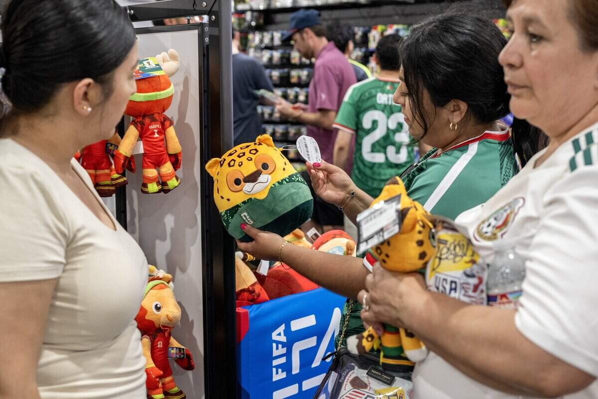 Shoppers browse FIFA World Cup mascot plush toys at the FIFA Store during the FIFA Fan Festival on Thursday, June 11, 2026, in Kansas City.