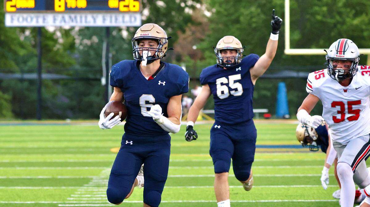 Senior Will Callahan scores a 26-yard touchdown for St. Thomas Aquinas in a 25-21 win on Friday, Sept. 6, 2024.