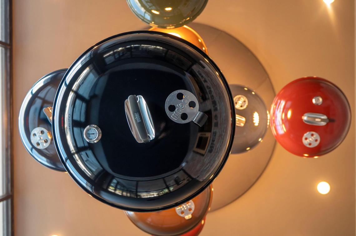 A chandelier hanging inside Meat Mitch Barbecue is made from the tops of Weber grills.