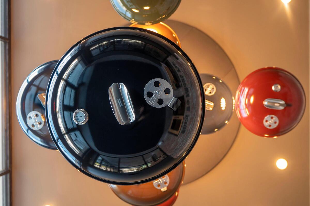 A chandelier hanging inside Meat Mitch Barbecue is made from the tops of Weber grills.