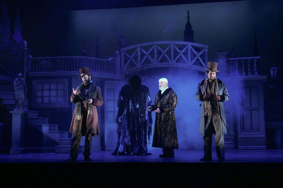 As seen in the Kansas City Repertory Theatre’s 2019 production of “A Christmas Carol,” Ebenezer Scrooge (Gary Neal Johnson) gets a wake-up call in a cemetery. This year, Johnson will take turns reading the tale.