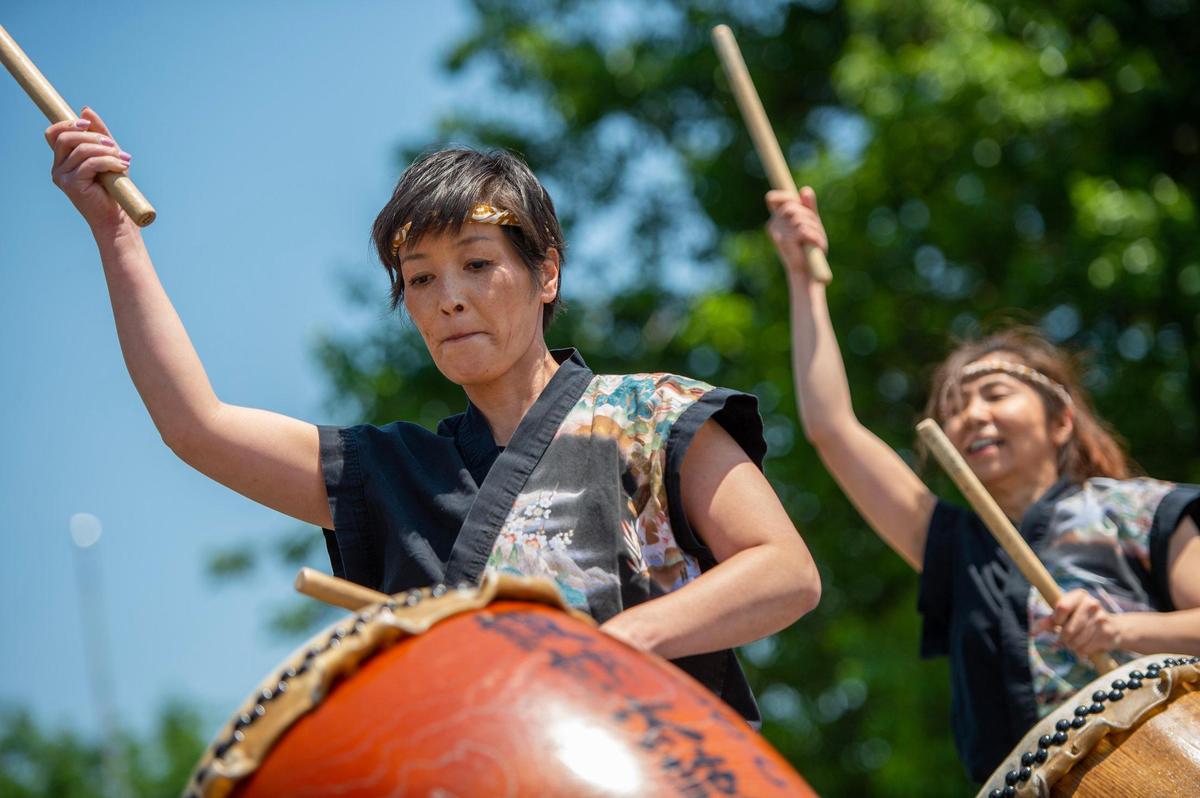 Members from Three Trails Taiko perform a song during the AAPIconic Festival on Saturday, May 20, 2023, in Kansas City.