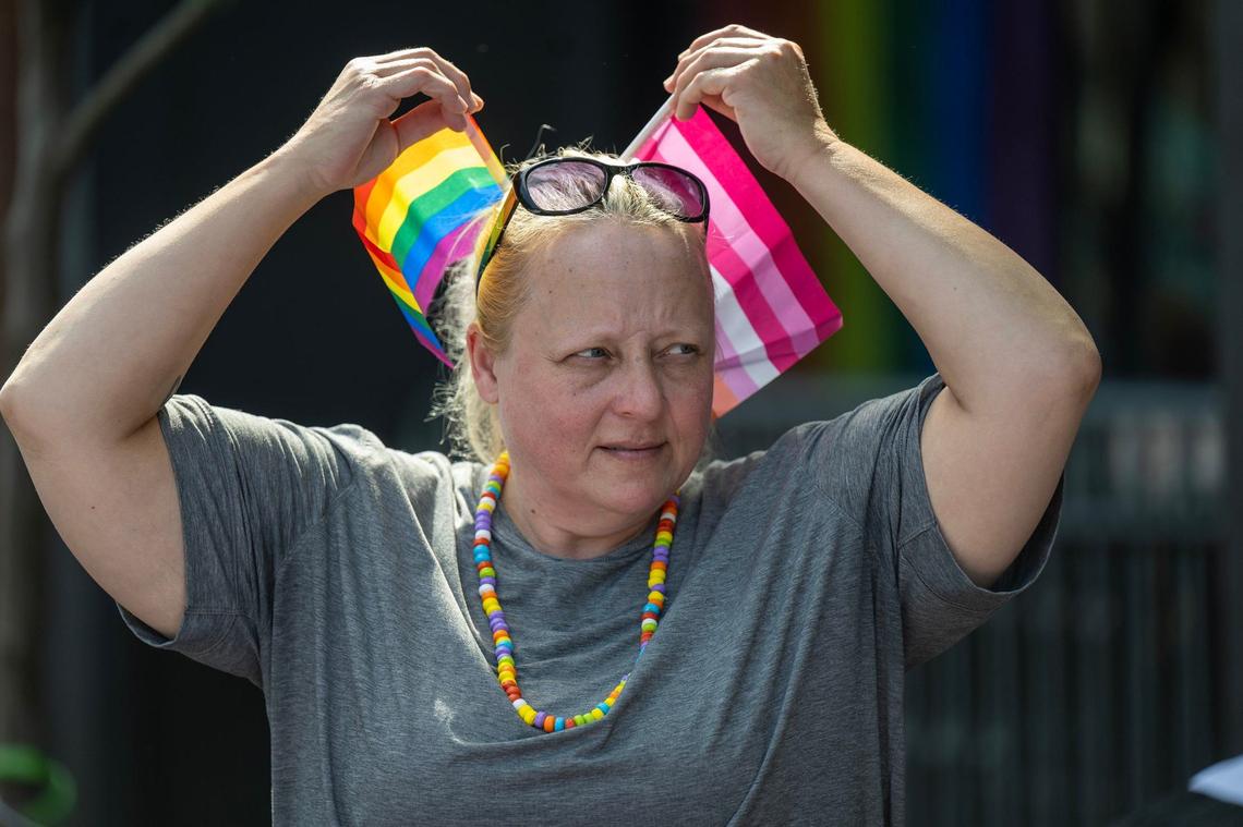 Amber Bourne of Lone Jack, Missouri, added some flags to her hair for the KC Pride Parade on Saturday in Kansas City. Bourne was with the Jackson County CASA group.